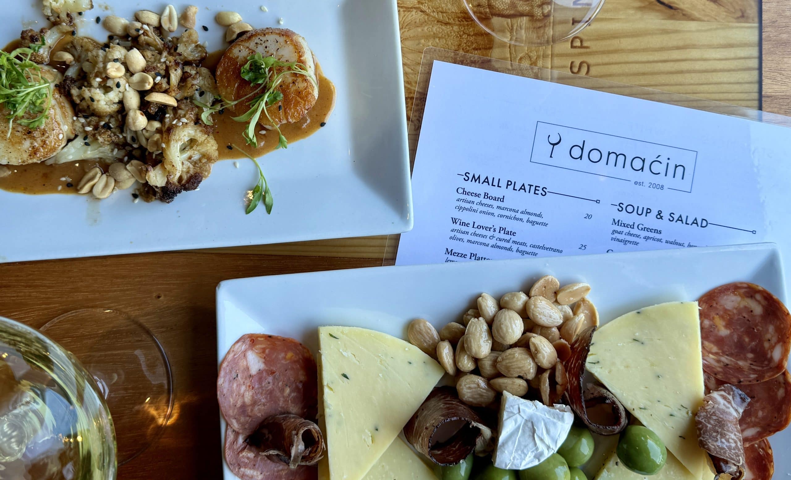 Plate of charcuterie and scallops at Domacin Restaurant in Stillwater, MN recommended for this Stillwater, MN overnight trip