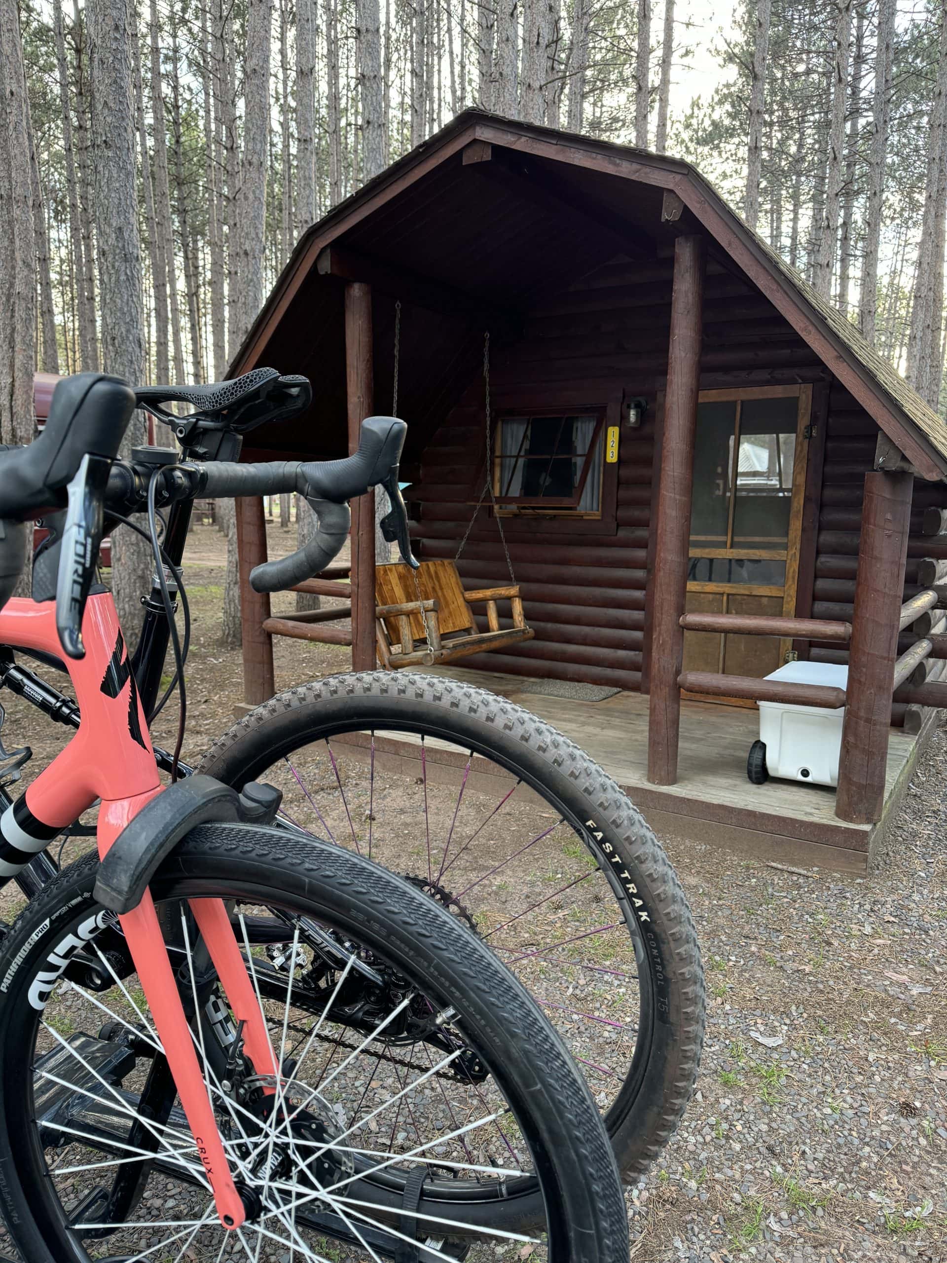 small rustic cabin we stayed in at Holiday Hayward KOA recommended in our Hayward, WI Camping Itinerary