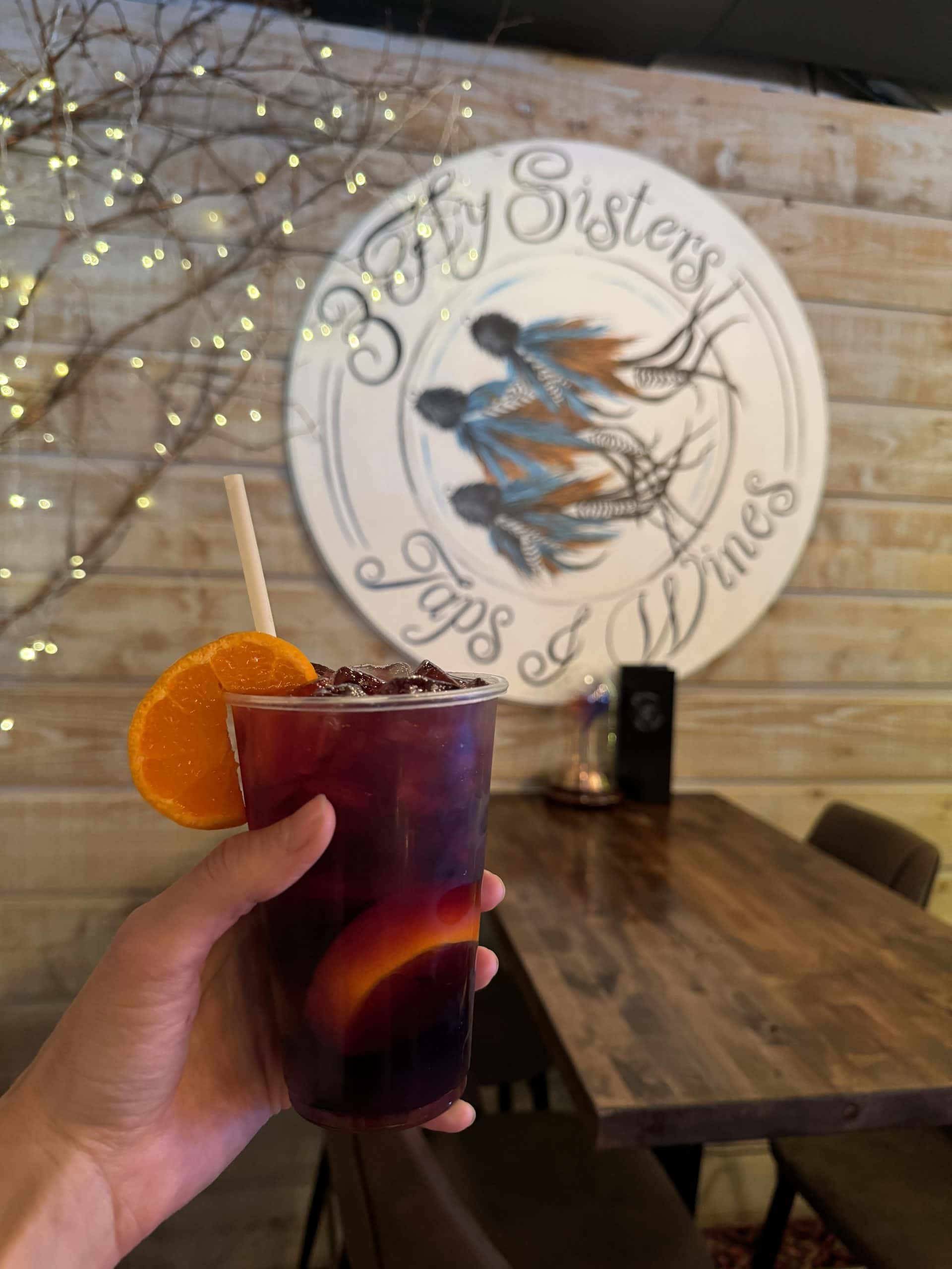 picture of sangria in a to-go cup at 3 fly sisters in Hayward, WI