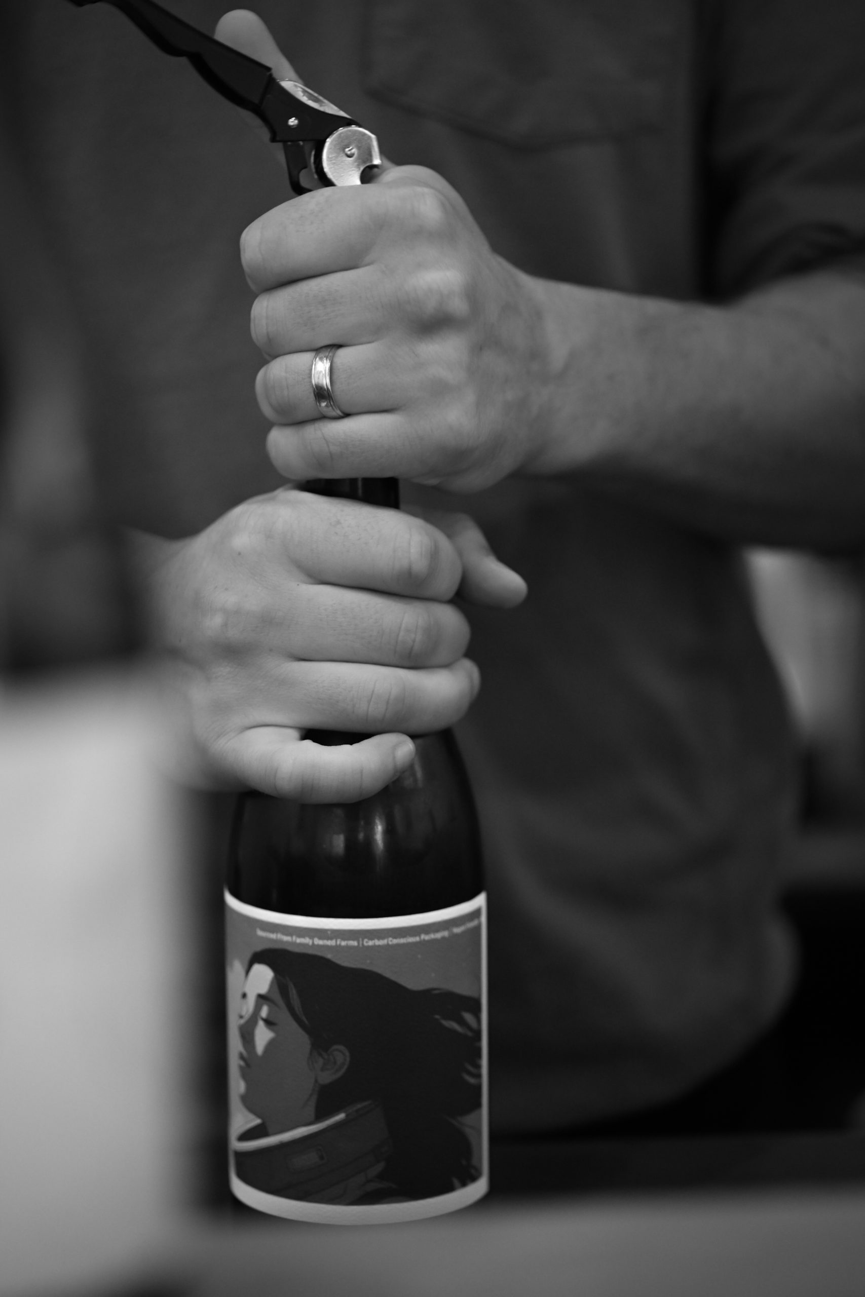 opening a bottle of wine at no love lost napa valley