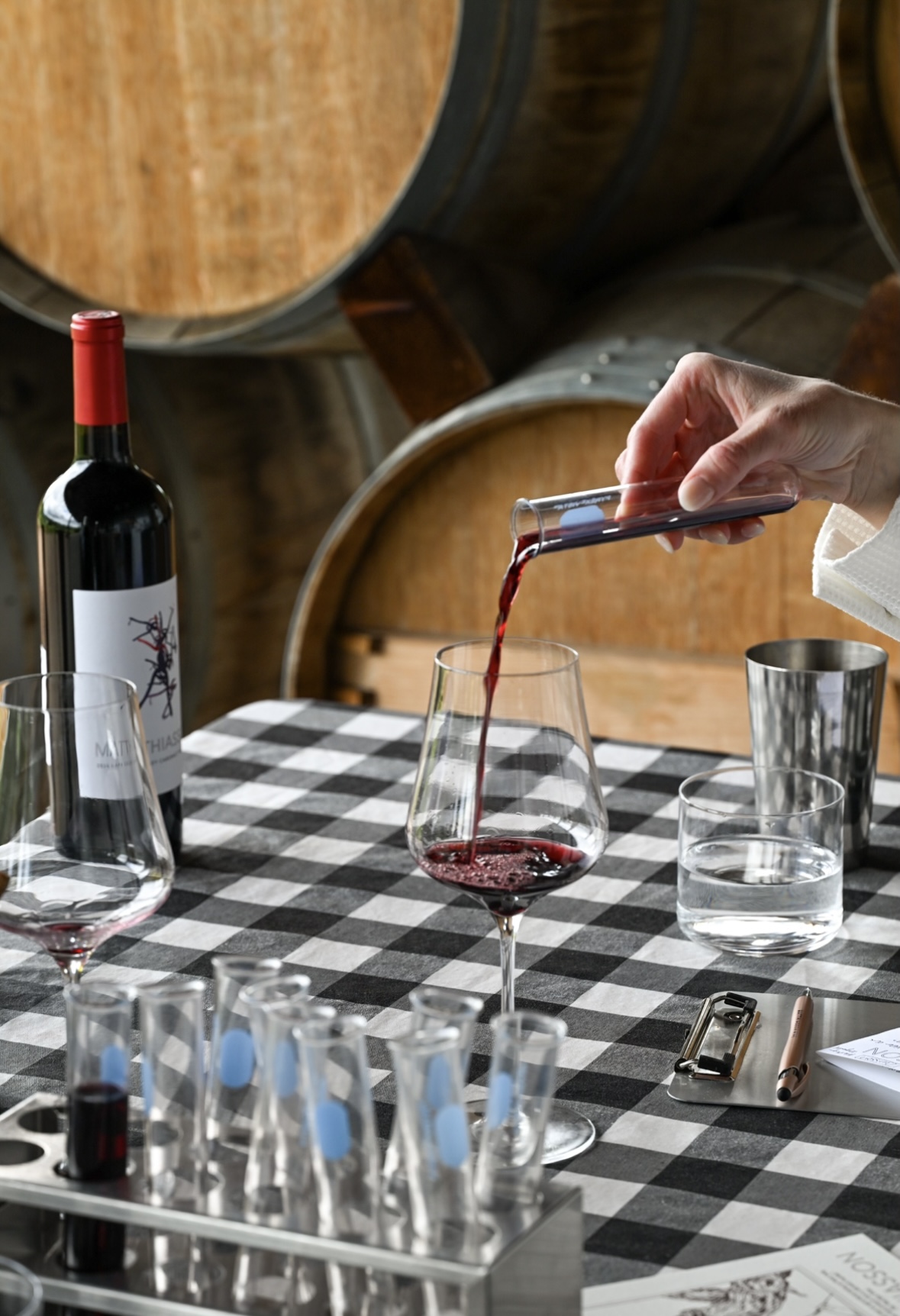 pouring wine out of a beaker for tasting at Matthiasson in Napa Valley