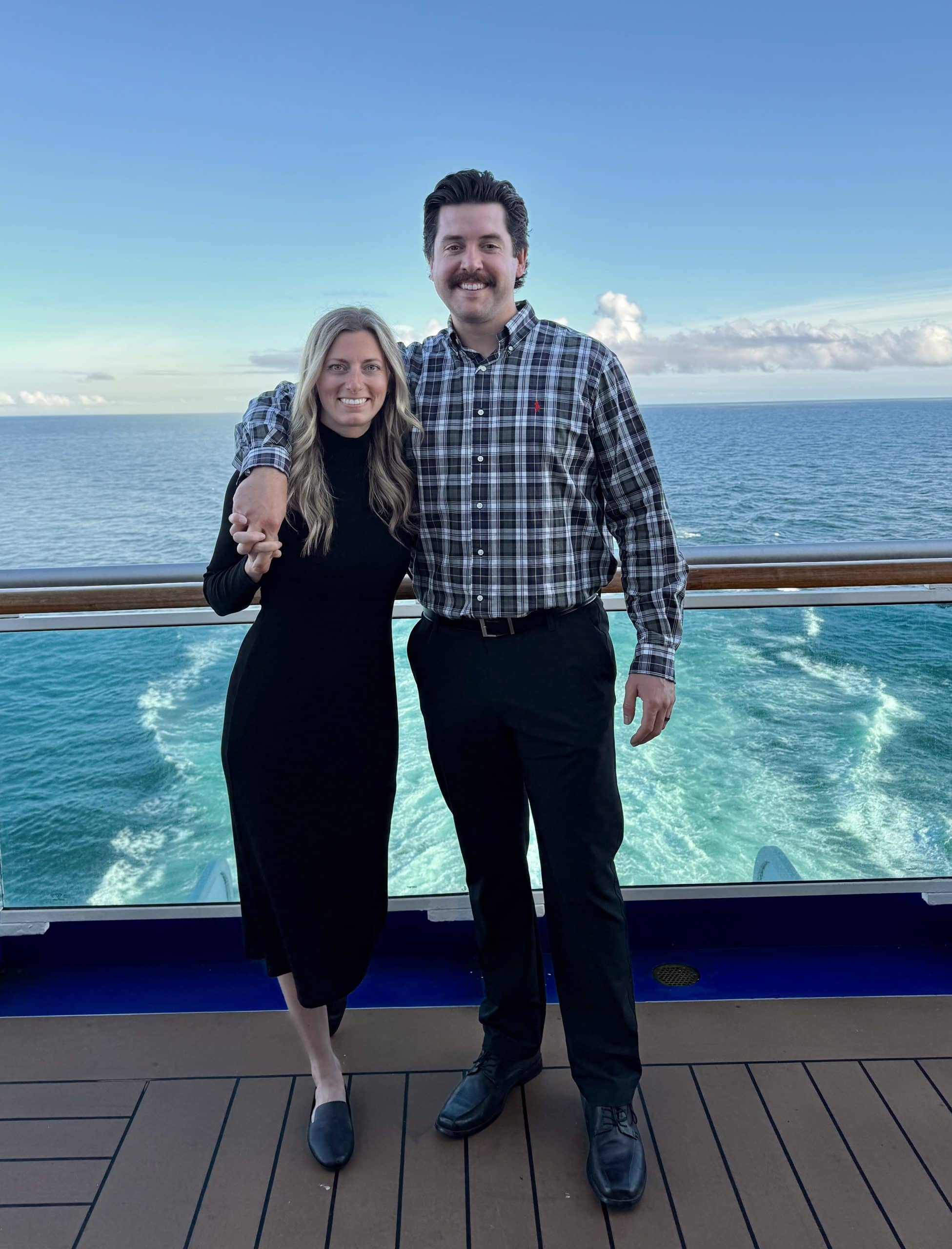 formal night on the royal princess in Alaska, Jacki and James posing in the back of the ship. image on my Alaska Cruise Packing List post.